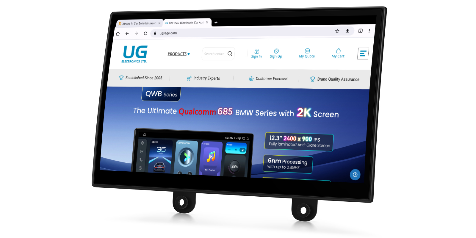 A car multimedia screen displaying a web browser open to the UG Electronics website, highlighting a promotional banner for the QWB Series featuring a Qualcomm 685 processor and a 2K screen.